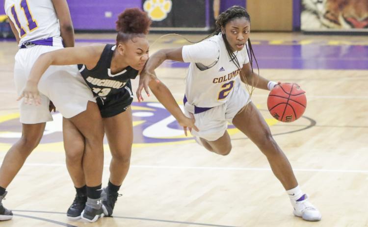 Columbia guard Na’Haviya Paxton drives to the basket against Buchholz during last season’s district championship game. (BRENT KUYKENDALL/Lake City Reporter)