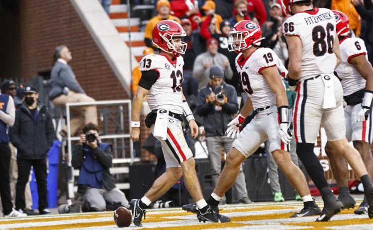 Georgia quarterback Stetson Bennett (13) celebrates with tight end Brock Bowers (19) after scoring a touchdown against Tennessee during Saturday's game in Knoxville, Tenn. (WADE PAYNE/Associated Press)