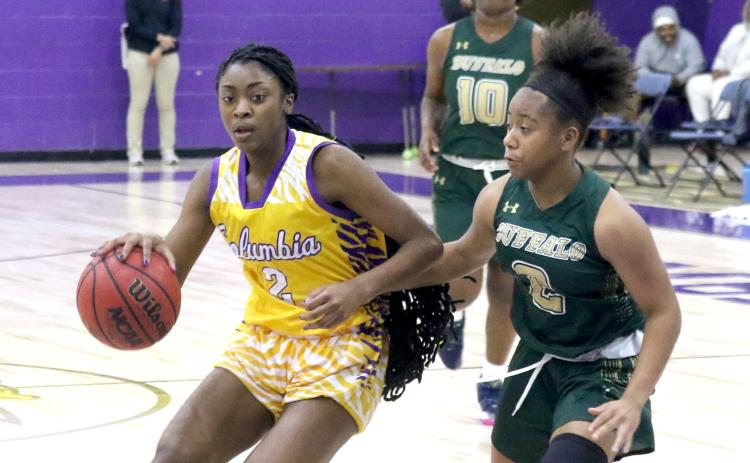 Columbia guard Na’Haviya Paxton drives to the basketball against The Villages Charter on Tuesday night. (JORDAN KROEGER/Lake City Reporter)