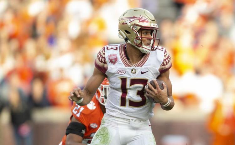 Florida State quarterback Jordan Travis runs Clemson Oct. 30 in Clemson, S.C. (HAKIM WRIGHT SR./Associated Press)