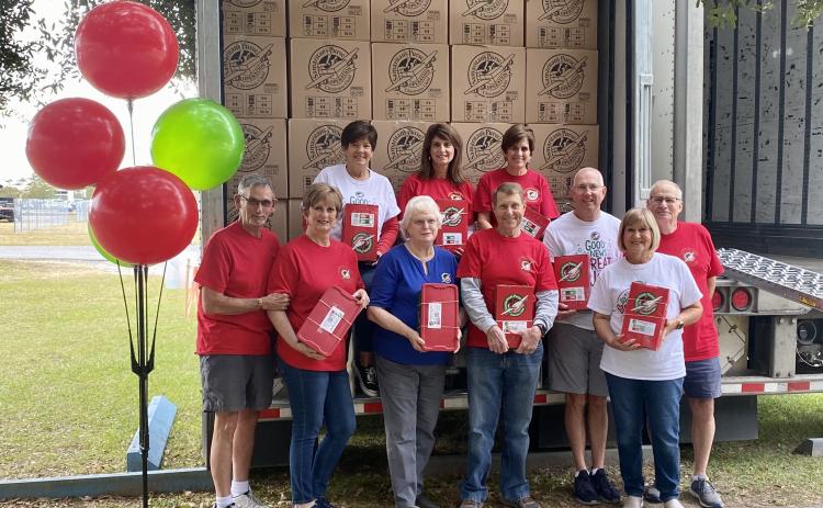Volunteers at the Operation Christmas Child’s Lake City collection center after loading more than 7,500 shoeboxes on two trucks last week. Pictured are, in front, Rickey Beauchamp (from left), Pam Beauchamp, Emily Harden, Gene Bullard, Jimmy Blanton, Cheryl Cox and Randy Cox; and in back, Beth Bullard, Tracy Osburn and Lou Blanton. (COURTESY)