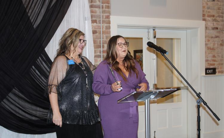 Lake City-Columbia County Chamber of Commerce Member Services Director Missy Hartley (left) congratulates Brooklynn Lacey on her win for Best New Business at the 2021 chamber’s Business Excellence Awards ceremony. (TONY BRITT/Lake City Reporter)