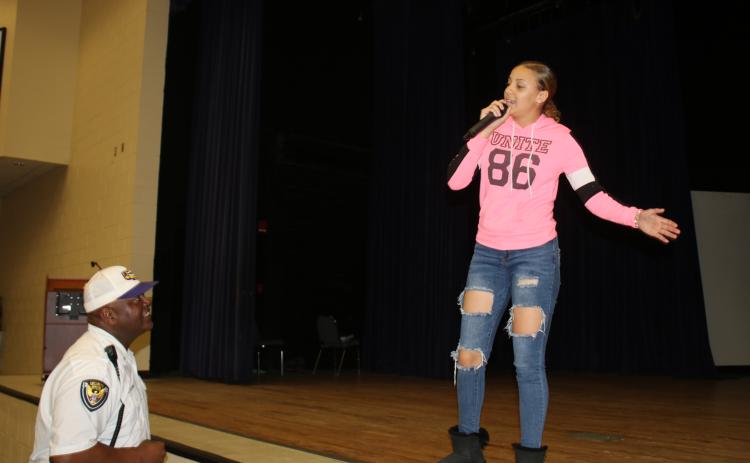 Ronnie Colins (left), Columbia’s Top Talent founder and a CHS security guard,  instructs Jalyssa Thomas, 16, a Columbia High School 11th grader, as she rehearses Monday afternoon for the first round of the annual talent competition which takes place Dec. 10. (TONY BRITT/Lake City Reporter)