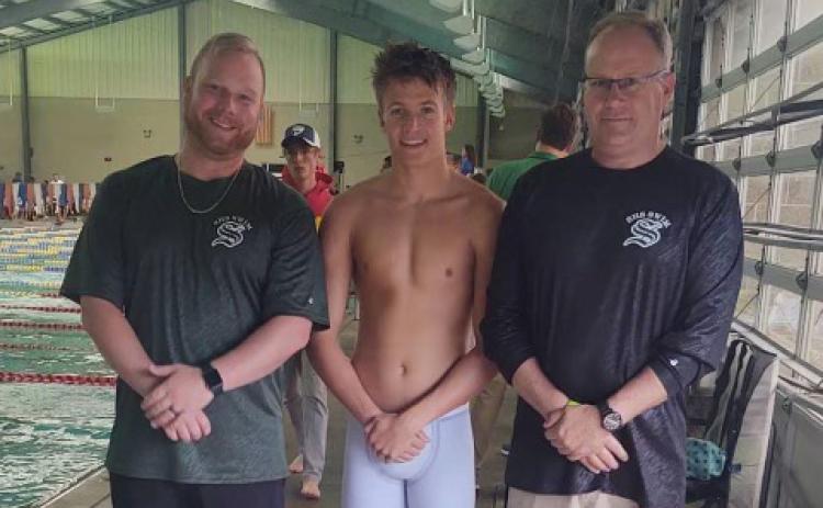 Suwannee swimmer Peyton Slaughter (middle) qualified for the Class 2A State Meet in the 50 freestyle and the 100 backstroke. Slaughter is pictured with assistant coach TJ Vickers (left) and head coach Doug Martin (right). (COURTESY)