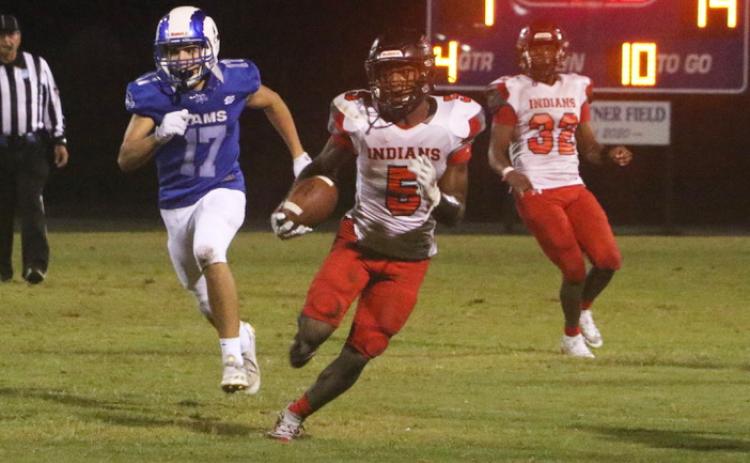 Fort White defensive back Darren Clark returns an interception against Interlachen on Friday. (MORGAN MCMULLEN/Lake City Reporter)