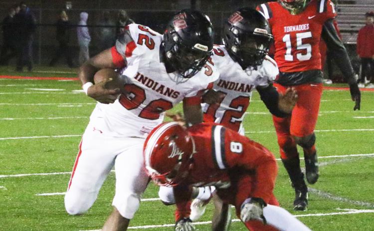 Fort White running back Kamarion Griffin is tackled by Bradford defensive back Jarrin Alexander on Friday night. (MORGAN MCMULLEN/Lake City Reporter)