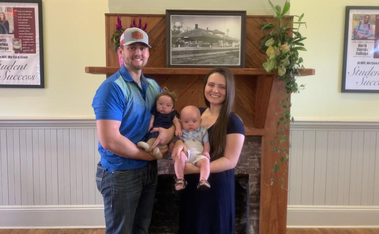Natalie Ellis (right), pictured with her husband Jonathan and twins Adelynn and Beckham, is set to graduate from North Florida College in December. (COURTESY)