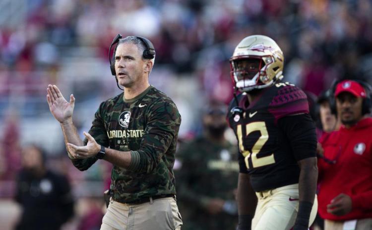 Florida State coach Mike Norvell applauds during a game against N.C. State on Nov. 6 in Tallahassee. (MARK WALLHEISER/Associated Press)