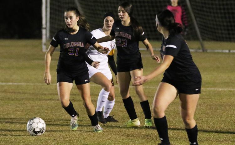 Columbia’s Sydney Rivas pushes the ball up the field against Lafayette on Monday night. (JORDAN KROEGER/Lake City Reporter)