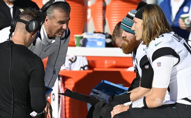 Jacksonville Jaguars head coach Urban Meyer speaks with Jacksonville Jaguars quarterback Trevor Lawrence (16) on the sideline during Sunday's game against the Tennessee Titans in Nashville, Tenn. (MARK ZALESKI/Associated Press)