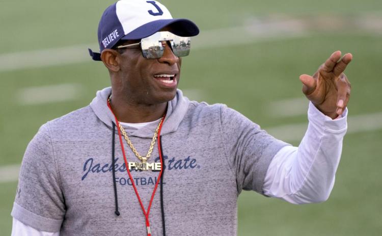 Jackson State head coach Deion Sanders points during a game against Louisiana Monroe on Sept. 18 in Monroe, La. Travis Hunter, the No. 1 high school football recruit in the country, pulled a signing day shocker on Wednesday deciding to attend Jackson State and play for coach Deion Sanders after being verbally committed to Florida State for months. (MATTHEW HINTON/Associated Press)