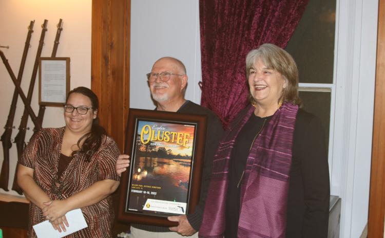 Olustee Festival photo contest winner John Clare Stokes (center) with Shannon Barker (left) and Sherri Carder during the unveiling the 2022 Olustee Festival poster. (TONY BRITT/Lake City Reporter)