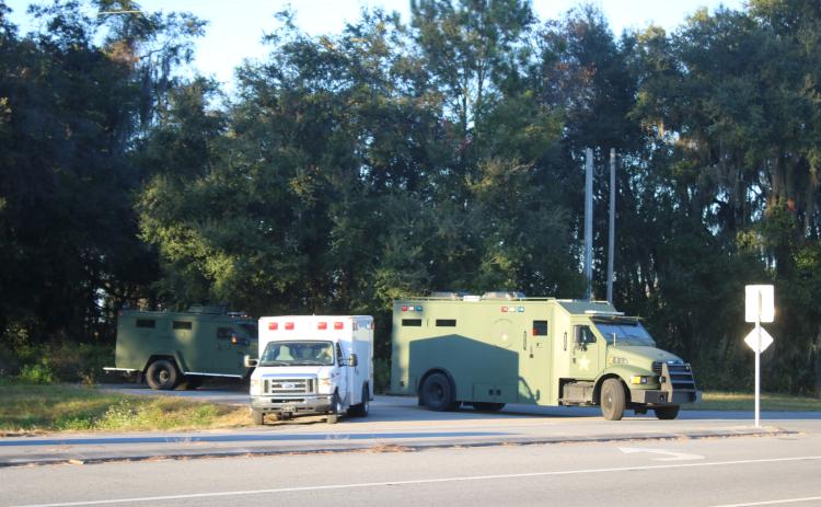 Alachua County SWAT vehicles pull onto County Road 236 in northern Alachua County following the capture of Marandoe Acell Lamar Young on Thursday. (TONY BRITT/Lake City Reporter)