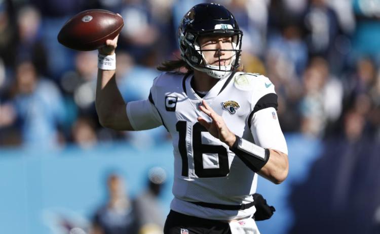 Jacksonville Jaguars quarterback Trevor Lawrence passes in the pocket against the Tennessee Titans on Dec. 12 in Nashville, Tenn. (WADE PAYNE/Associated Press)
