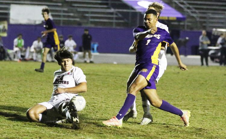 Columbia’s AJ Brinson fires a shot inside the penalty box as Bishop Kenny defenders rush in during Thursday’s match. (MORGAN MCMULLEN/Lake City Reporter)