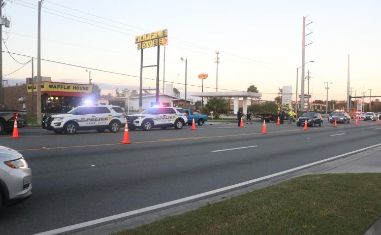 Lake City Police Department vehicles cordone off a stretch of road on U.S. Highway 90 west of Interstate 75 on Tuesday afternoon. One pedestrian was killed while no other injuries were reported. (MORGAN MCMULLEN/Lake City Reporter)