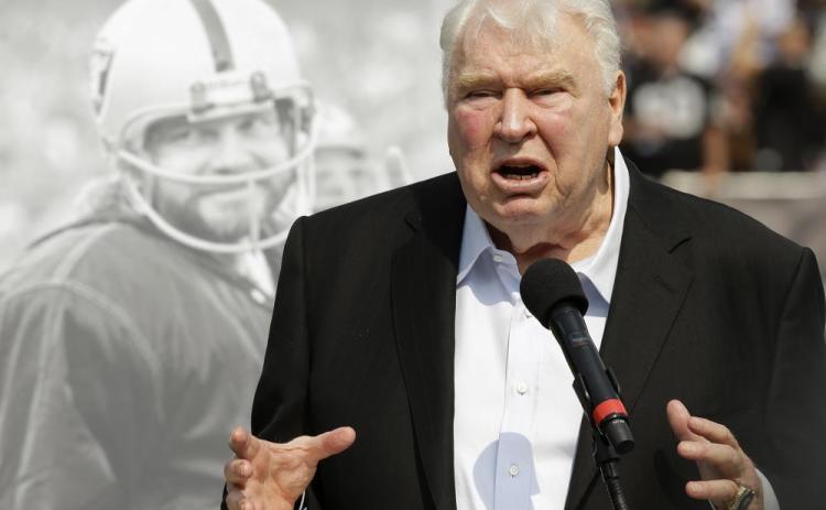 Former Oakland Raiders head coach John Madden speaks about former quarterback Ken Stabler, pictured at rear, at a ceremony honoring Stabler during halftime of a game between the Raiders and the Cincinnati Bengals on Sept. 15, 2015, in Oakland, Calif. (AP File)