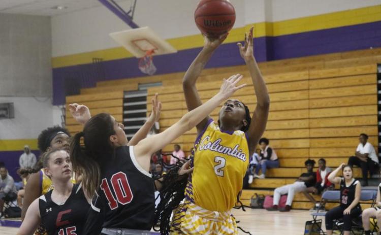 Columbia guard Na’Haviya Paxton shoots over Creekside guard Lauren Yezbick during a Dec. 9 game at CHS. (JORDAN KROEGER/Lake City Reporter)