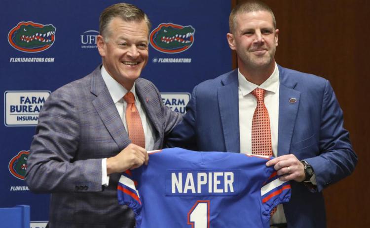 New Florida head football coach Billy Napier, right, and athletic director Scott Stricklin pose for a photo as Napier is introduced during a news conference at Ben Hill Griffin Stadium on Dec. 5 in Gainesville. (BRAD MCCLENNY via AP)