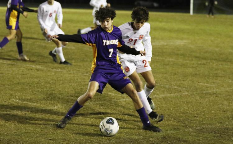 Columbia’s Wesley Wingate battles for possession of the ball with Leon’s Andres Fernandez on Wednesday night. (JORDAN KROEGER/Lake City Reporter)