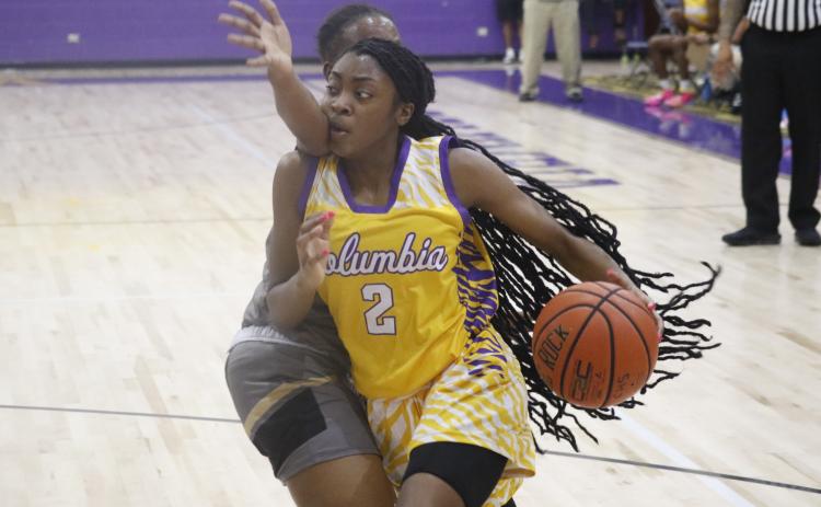 Columbia guard Na’Haviya Paxton drives by a Buchholz defender on Tuesday night. (JORDAN KROEGER/Lake City Reporter)
