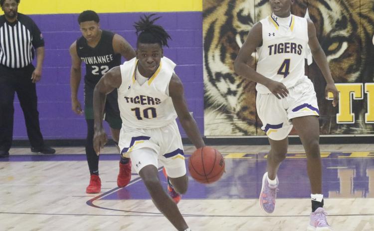 Columbia guard Isaac Broxey pushes the ball up the court in transition against Suwannee on Friday. (JORDAN KROEGER/Lake City Reporter)