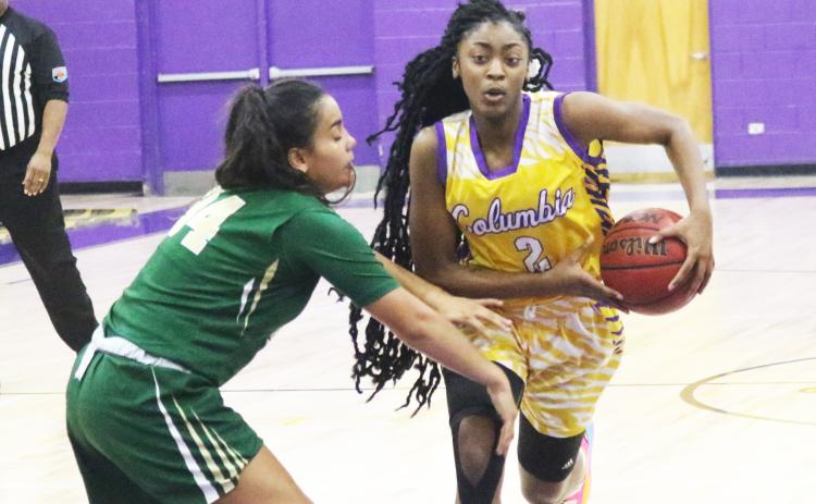 Columbia guard Na’Haviya Paxton drives to the basket as Nease guard Savannah Gomes defends on Tuesday night. (JORDAN KROEGER/Lake City Reporter)