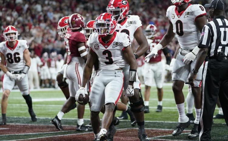 Georgia’s Zamir White celebrates after running for a touchdown during the second half of the College Football Playoff championship football game against Alabama Monday, Jan. 10, 2022, in Indianapolis. (PAUL SANCYA/Associated Press)