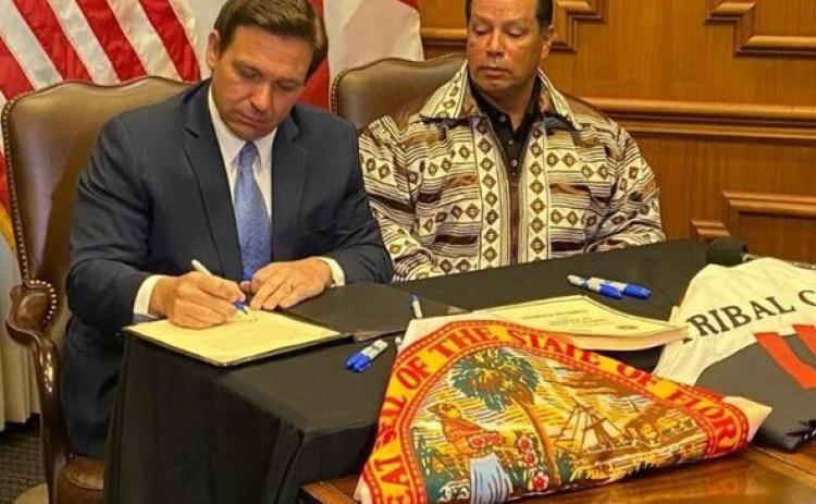 Gov. Ron DeSantis and Seminole Tribe of Florida Chairman Marcellus Osceola Jr. signed a gambling deal in April. (COURTESY)