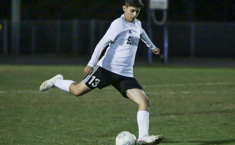 Suwannee's Alex Beristain passes the ball up the field against Columbia on Jan. 7. (BRENT KUYKENDALL/Lake City Reporter)