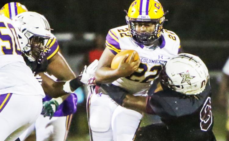 Columbia running back Tony Fulton is tackled on a carry against Madison County this past season. (BRENT KUYKENDALL/Lake City Reporter)