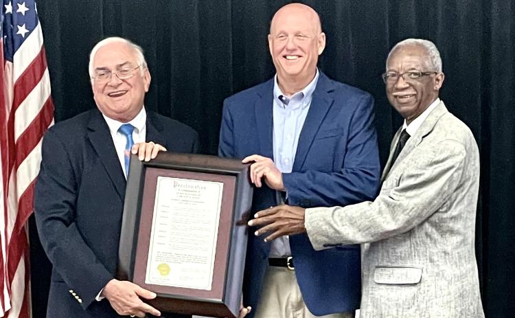 Florida Forestry Association President Carlton Jones, center, is presented a proclamation recognizing him as Lake City’s Arbor Day honoree by Mayor Stephen Witt and Councilman Eugene Jefferson. (COURTESY)