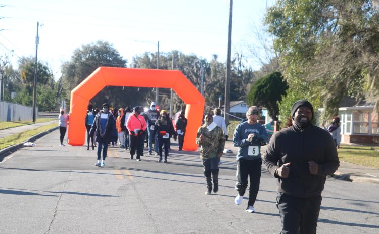 An estimated 40-60 people participated in the inaugural MLK Day 3K Walk/Run event in Lake City. (TONY BRITT/Lake City Reporter)