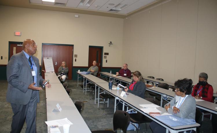 NorthStar Family Resource Center Manager Philip Mobley (left) gives a lesson on building strategies for non-profits. (TONY BRITT/Lake City Reporter)