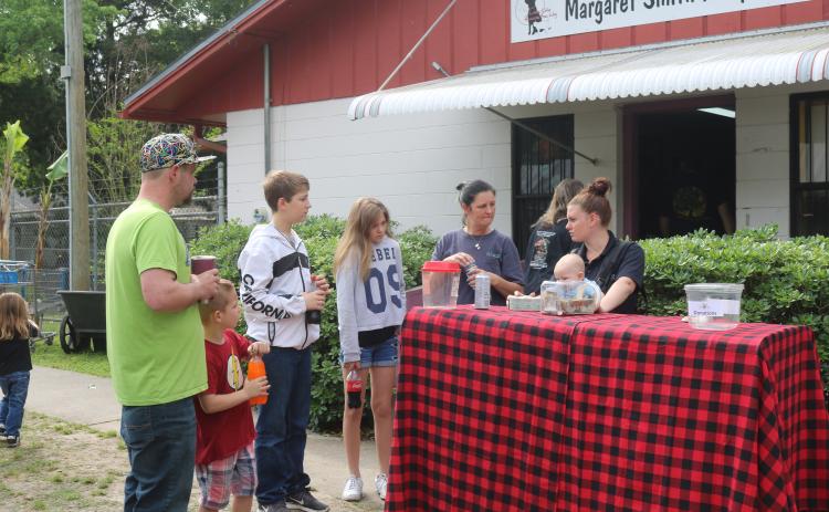 People congregate outside the Lake City Humane Society adoption center during an adoption event in April 2019. County officials will discuss options that would refine animal control services. (FILE)