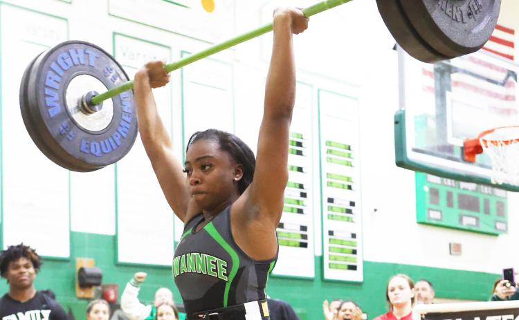 Suwannee lifter Tyra Kalandyk finishes her clean and jerk during the Region 1-1A Meet on Friday. (PAUL BUCHANAN/Special to the Reporter)