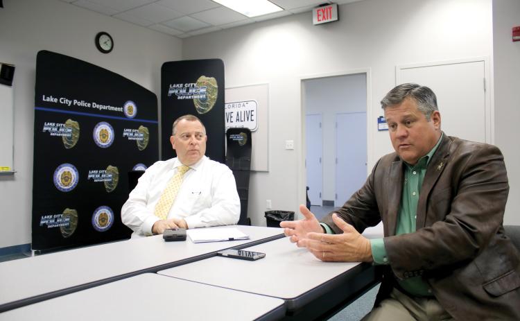 Sheriff Mark Hunter (right) and Lake City Interim Police Chief Gerald Butler have reached a deal to have the agencies work together more closely. (TONY BRITT/Lake City Reporter)