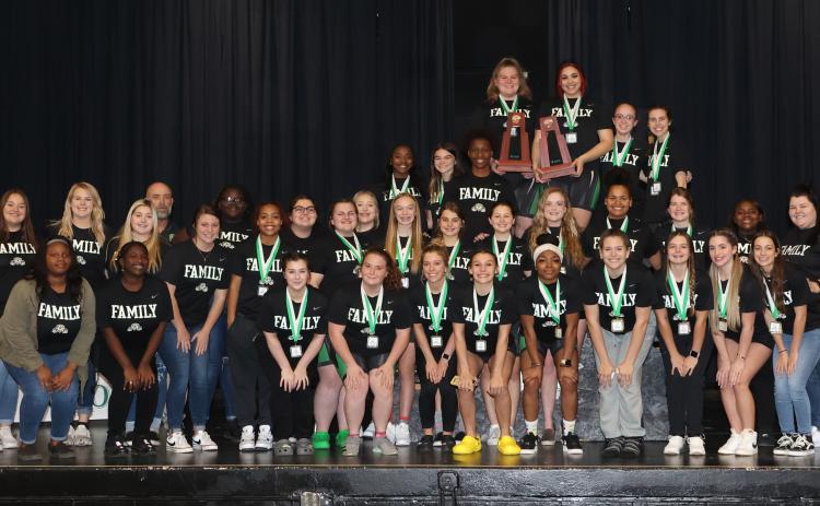 Suwannee’s girls weightlifting team poses with the District 4-1A trophy on Friday. (PAUL BUCHANAN/Special to the Reporter)
