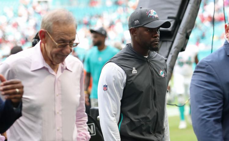 Miami Dolphins head coach Brian Flores, right, walks off the field next to Dolphins owner Stephen Ross after losing to the Atlanta Falcons at Hard Rock Stadium on Oct. 24, 2021, in Miami Gardens. (JOHN MCCALL/South Florida Sun-Sentinel/TNS)