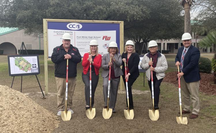 Keith Couey, Dana Brady-Giddens, Narrie Smith, Stephanie Johns, Keith Hudson and Lex Carswell break ground Tuesday afternoon at the site of Fort White High School’s new auditorium building. (COURTESY)