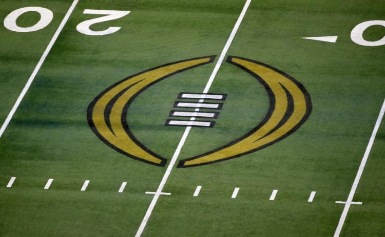 The College Football Playoff logo is shown on the field at AT&T Stadium on Jan. 1, 2021, in Arlington, Texas. (AP FILE)