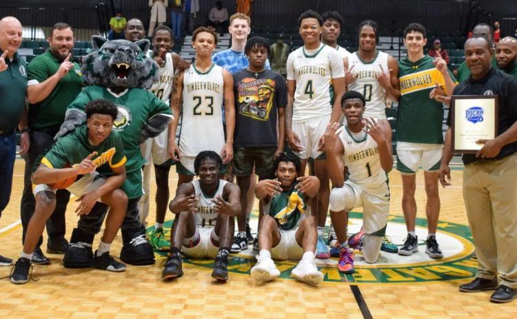 FGC's basketball team celebrates after winning the Region 8 championship on Saturday. (COURTESY)