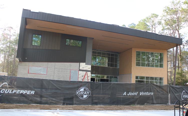 Construction workers continue working on the new STEM building on the Florida Gateway College campus Wednesday afternoon. The $12.8 million project is scheduled to be substantially complete by mid-April with hopes of opening in June. (TONY BRITT/Lake City Reporter)