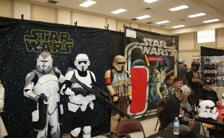 Dave Tischhauser (left) and David Burks (middle) pose in their Star Wars cosplay Saturday afternoon. (TONY BRITT/Lake City Reporter)