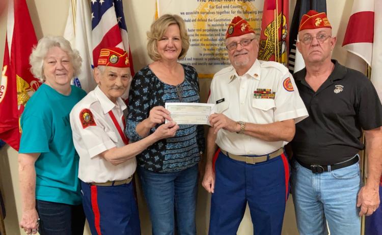 Spirit of the Suwannee Music Park General Manager Teena Peavey recently presented the Tri-County Veterans Fund with a $40,000 check from donations made during the Suwannee Lights event at the park. Pictured with Peavey (center) are Tri-County Veterans Fund volunteers Pat Walsh (from left), Mike Russell, Jim Kennedy and Russ Carson. (COURTESY)