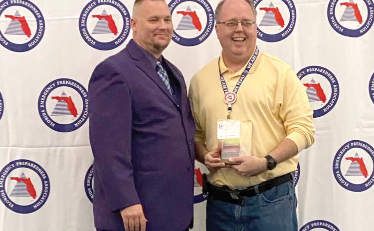 Shayne Morgan (right), Columbia County’s emergency management director, was honored as the Florida Emergency Preparedness Association’s Chad Reed Emergency Management Professional of the Year. (COURTESY)