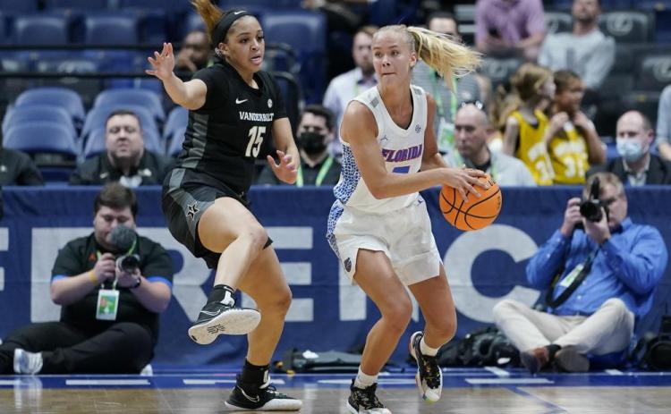 Vanderbilt's Brinae Alexander (15) defends against Florida's Alberte Rimdal (right) during the women's Southeastern Conference tournament on Thursday in Nashville, Tenn. (MARK HUMPHREY/Associated Press)
