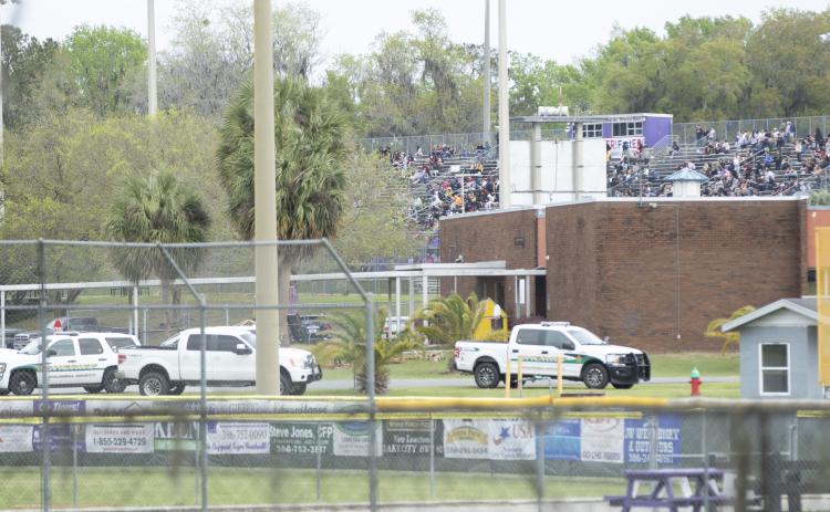 A Columbia County Sheriff’s Office vehicle sits parked near Tiger Stadium, where students waited on buses to safely evacuate Columbia High School. Law enforcement officials found no explosive devices on the scene. (JAMIE WACHTER/Lake City Reporter)