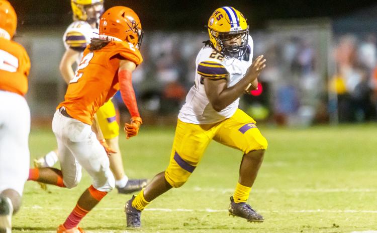 Columbia running back Tony Fulton rushes up the field against Orange Park last season. The two teams will play in District 3-3S this season with Middleburg and Ridgeview. (FRAN RUCHALSKI/Special to the Reporter)