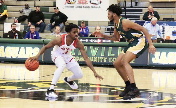 Allen guard Brandon Lawrence is defended by FGC guard Antonio Card during Wednesday’s consolation bracket game in the NJCAA Division II tournament at Danville Area Community College’s Mary Miller Complex in Danville, Ill. (COURTESY)